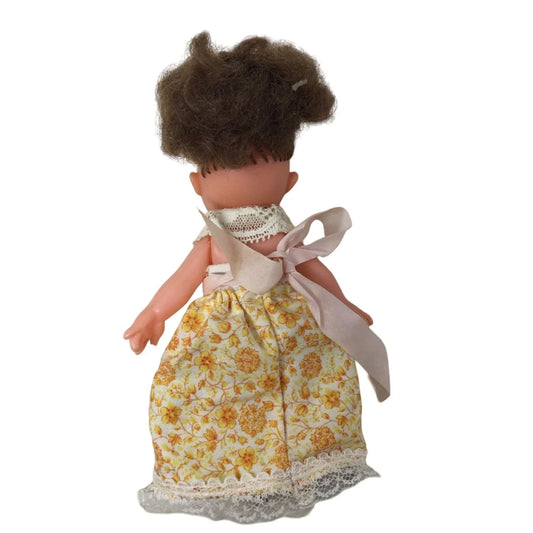 Vintage Collectible Small Baby Doll Brown Hair, Blue Eyes Wearing Yellow Floral Printed Dress A+ Stuff A+ Stuff
