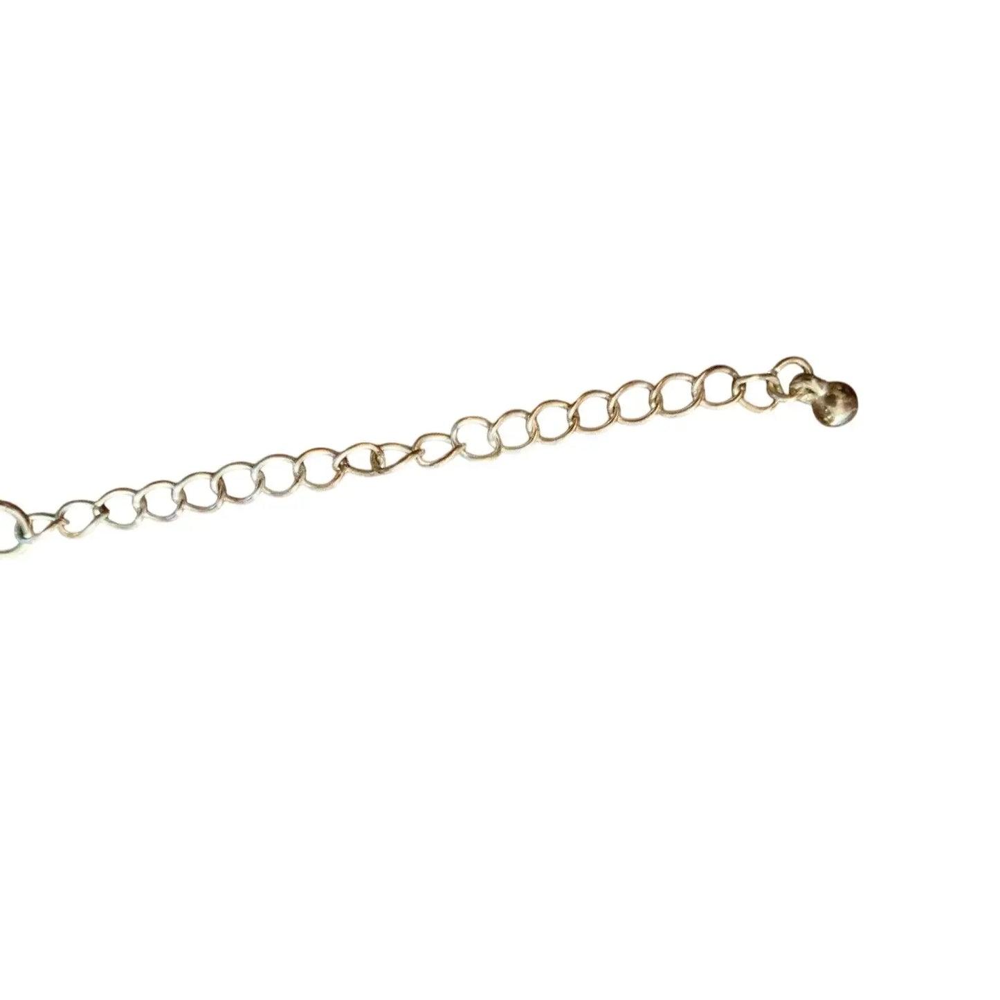 Gold jewelry chain extender with round links on white background