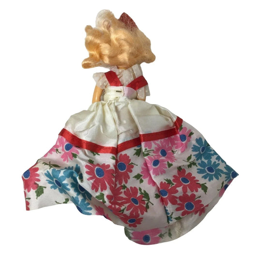 Vintage Collectible Doll With Blonde Hair wearing floral printed dress/red bow A+ Stuff A+ Stuff