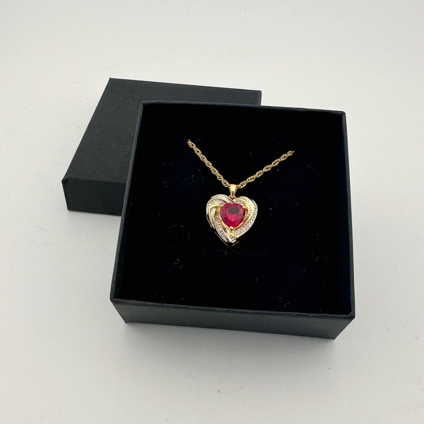 Elegant and Eye Catching Ruby Heart with Round and Baguette White Sapphires Surrounding - BEAUTIFUL!