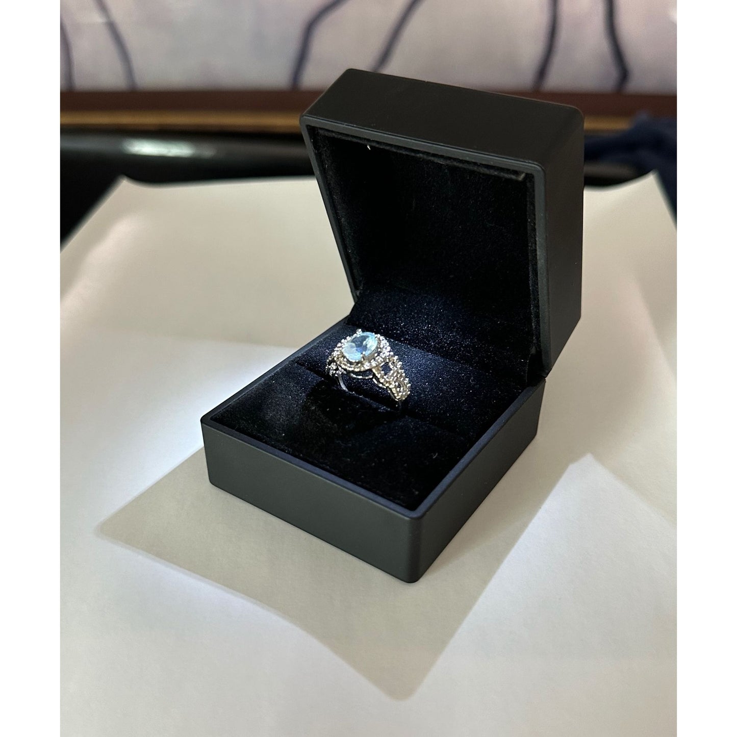 Beautiful Floating Oval Natural Blue Topaz with Textured Detailing and Diamond Accent