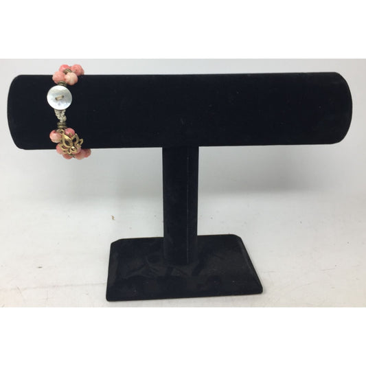 Women's Gold Tone Bracelet with Pink Flowers on it