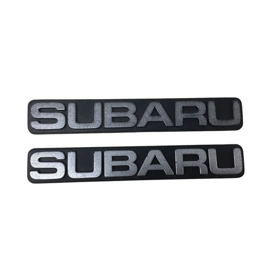 Two Subaru Auto Emblems/Hood Ornaments Silver and Black subaru A+ Stuff