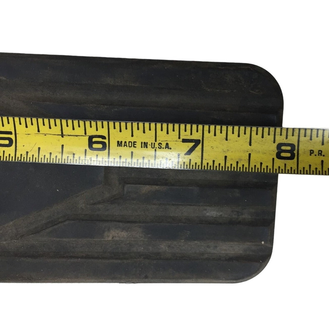 Black Rubber Automotive Replacement Part- Black Rectangle with Arrow on it