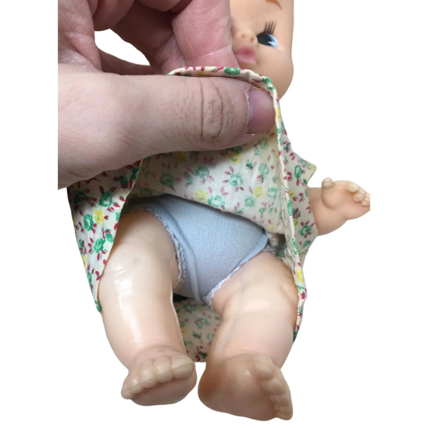 Vintage Collectible Baby Doll Blonde Hair/Green Floral Printed Dress- Rattles when you shake it A+ Stuff A+ Stuff