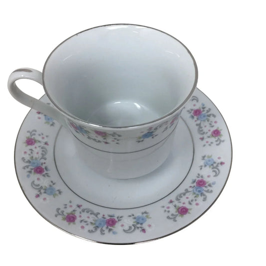 F.T.D.A 1987 Teacup and Saucer Set with Pink/Blue Flowers printed on both F.T.D.A A+ Stuff