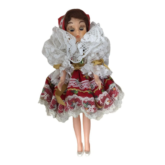 Collectible Brunette/Blue Eyed Doll Wearing Patterned Dress- Head, arms and eyes move. A+ Stuff A+ Stuff