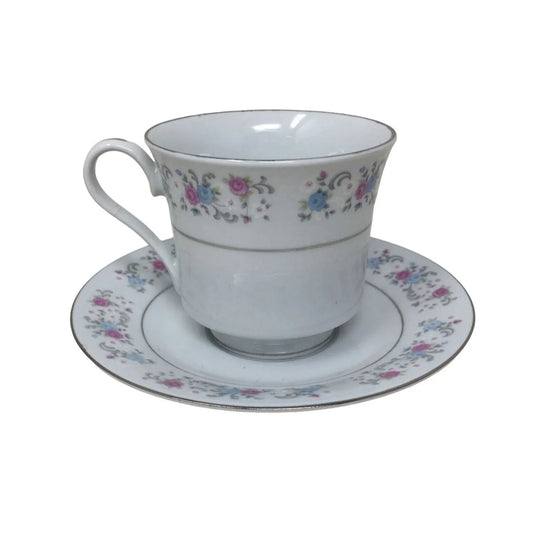 F.T.D.A 1987 Teacup and Saucer Set with Pink/Blue Flowers printed on both F.T.D.A A+ Stuff