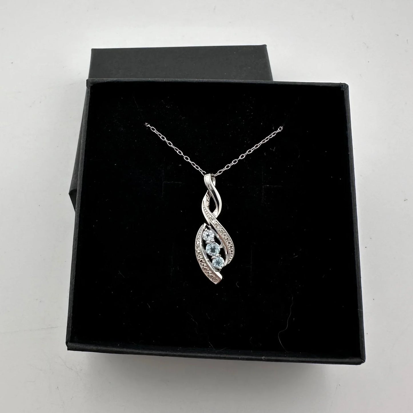 Blue Topaz Swirling Ribbon Necklace with Diamond Accent - A+ Stuff