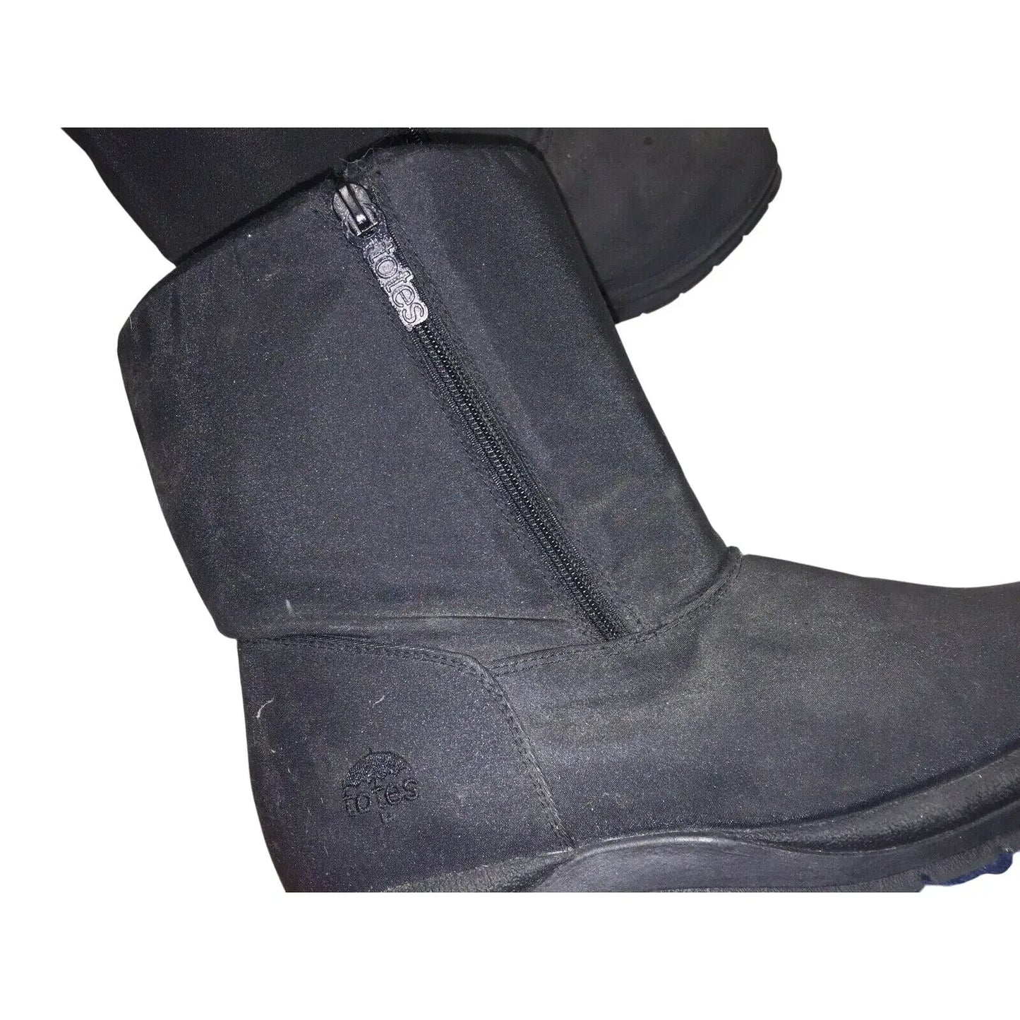 Black winter boots with side zippers and embossed logo, close-up view