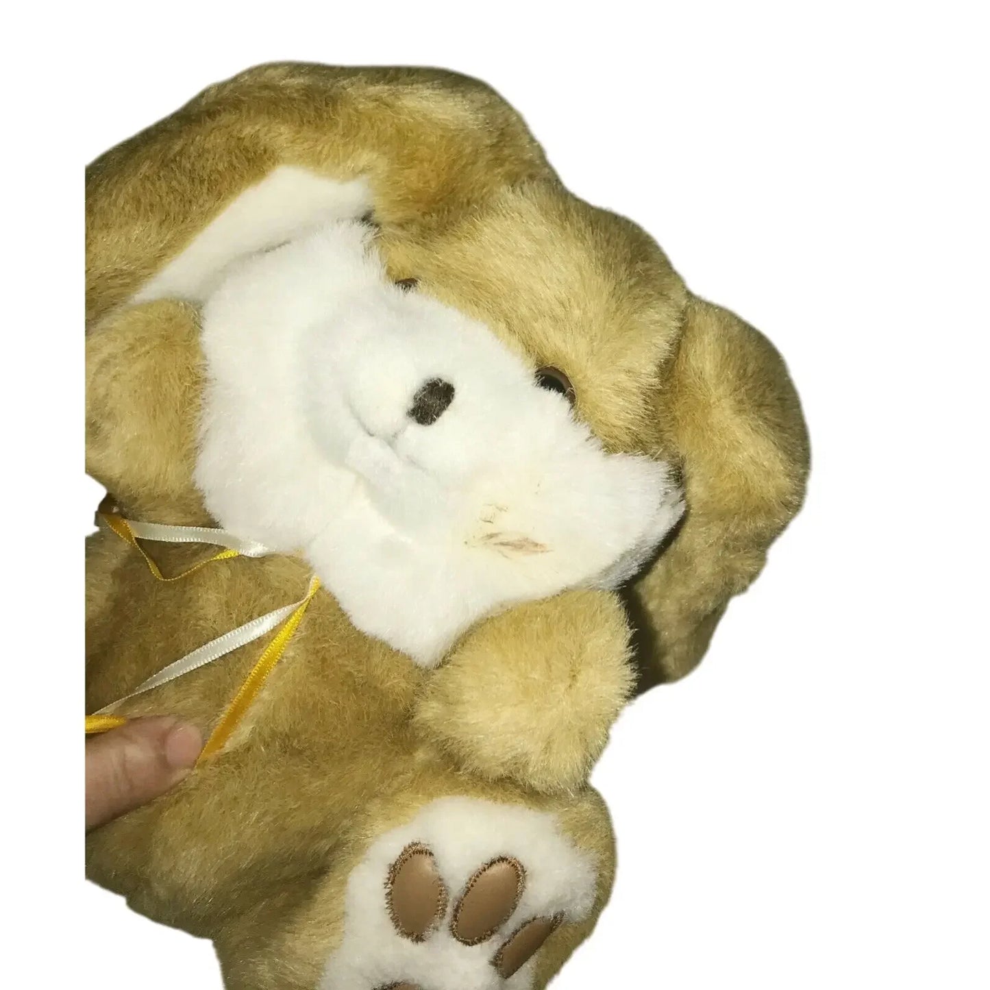 Plush brown bunny stuffed animal with floppy ears and white face, ribbon bow, and paw details