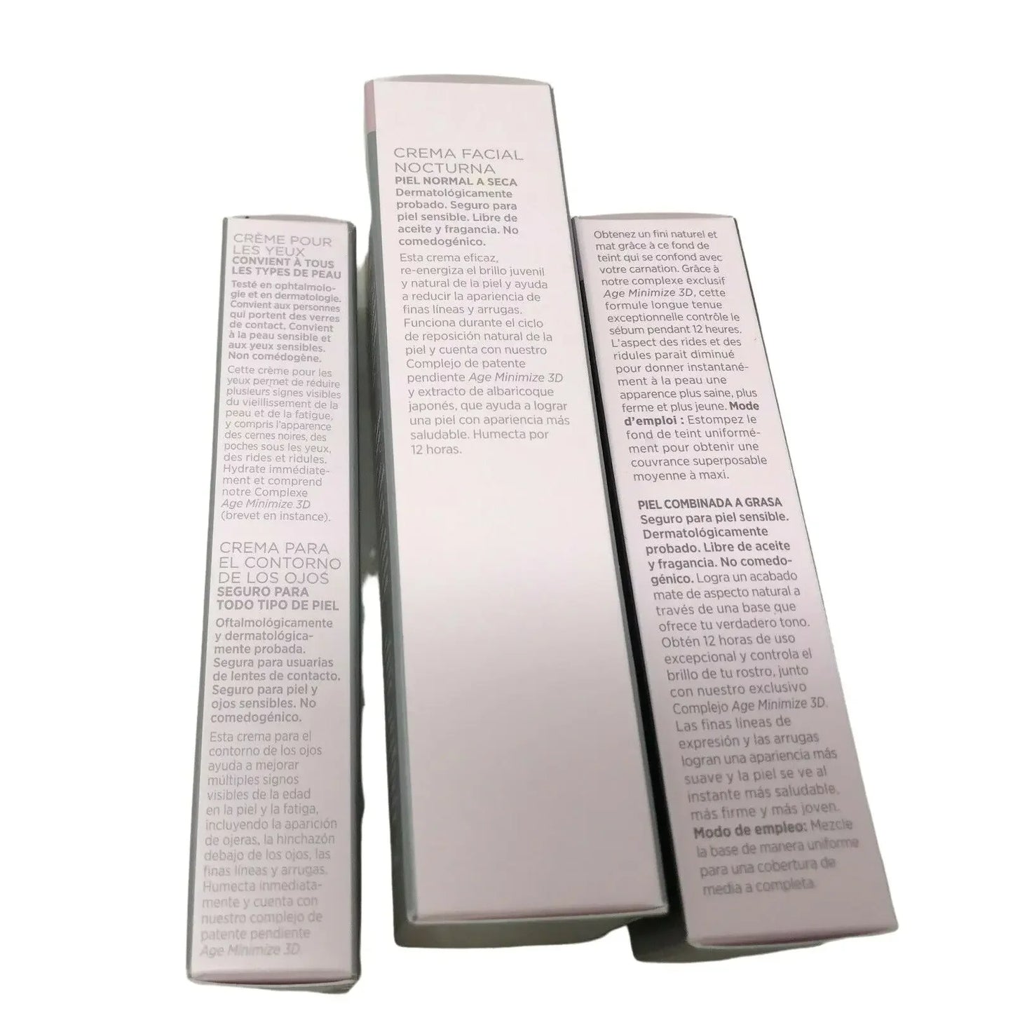 Three skincare product boxes with eye cream and facial cream descriptions in Spanish and French.