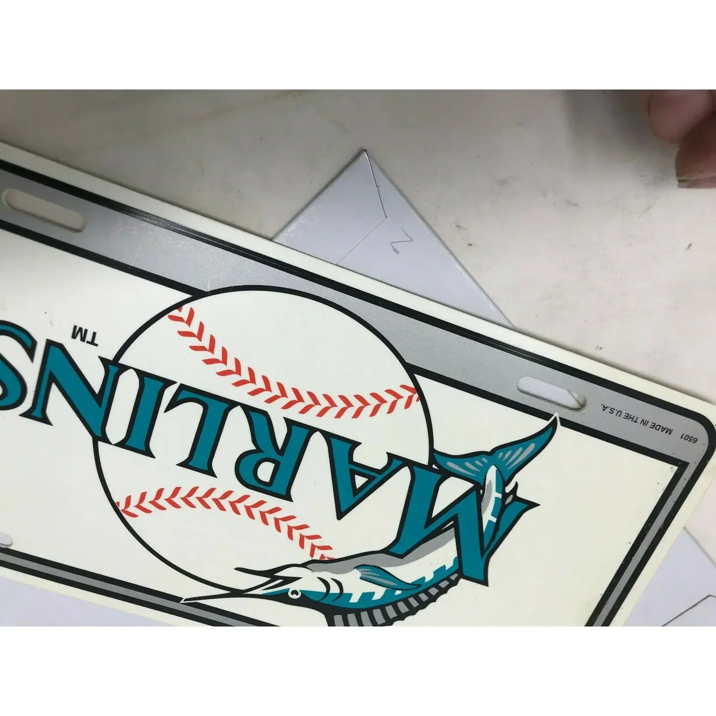 Marlins baseball team license plate with marlin fish graphic and baseball design