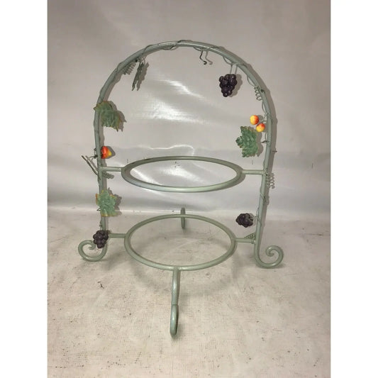 Two-tiered metal fruit basket stand with grape and leaf decorations