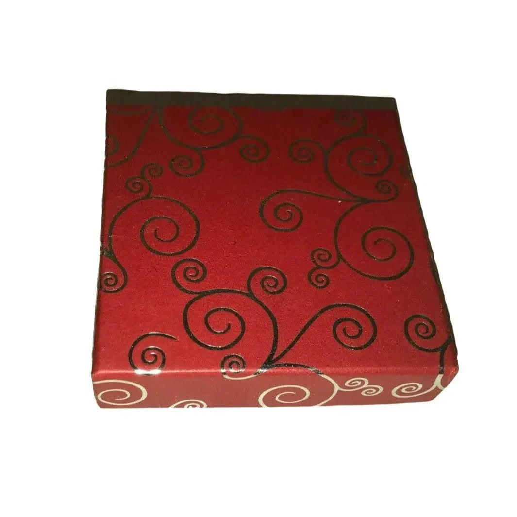 Red square gift box with black swirl pattern on white background