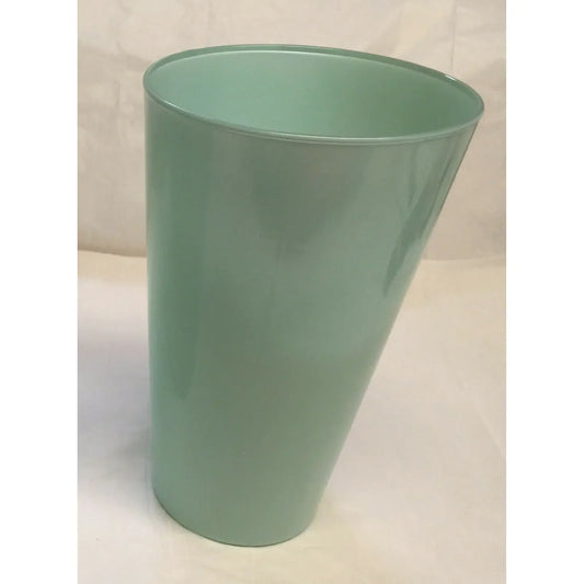 Light green plastic wastebasket on a neutral background, minimalist trash bin