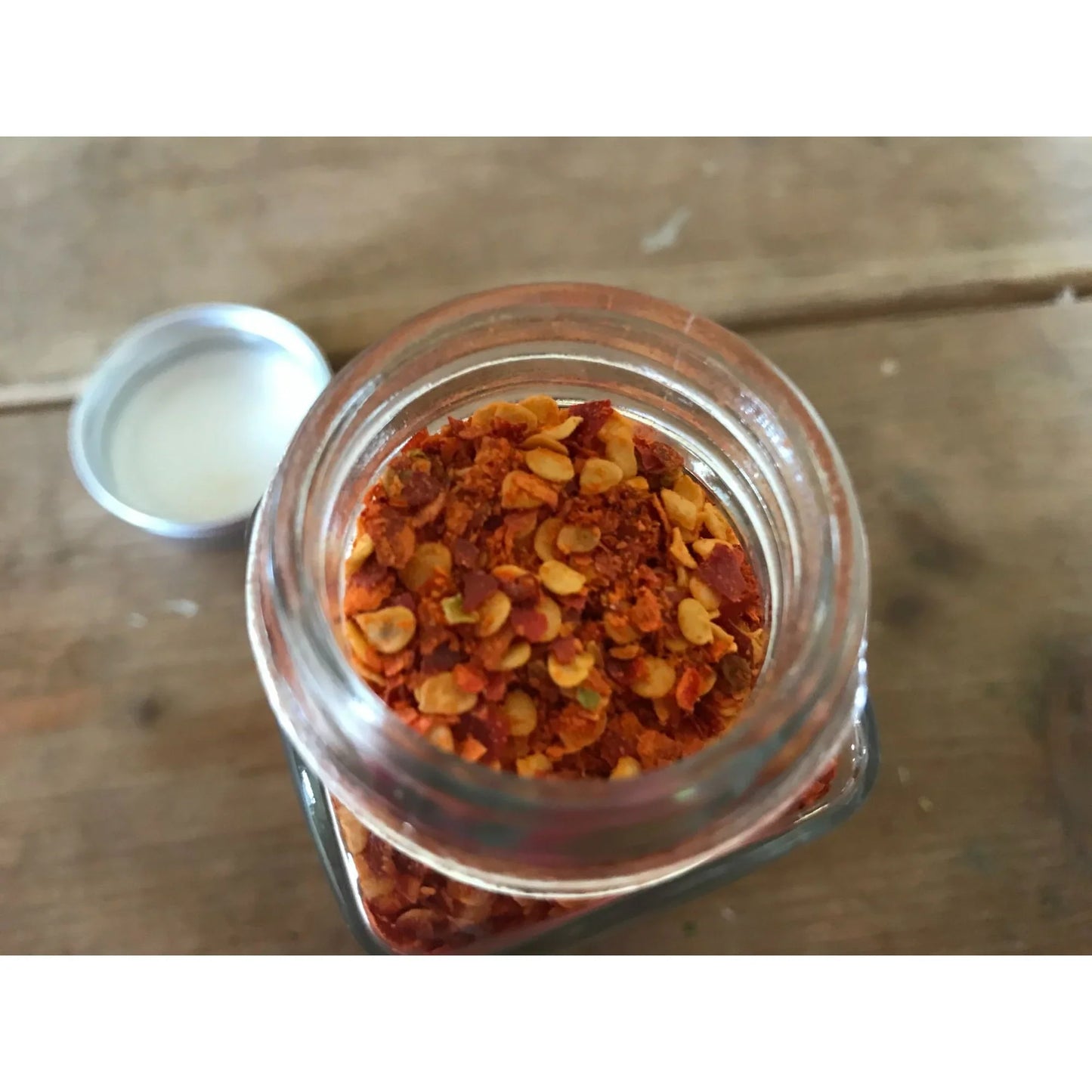 Dried and crushed Red Chili peppers to add a kick! No other ingredients. Carpenter Quality Goods A+ Stuff