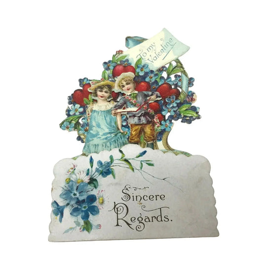 Vintage Valentine card with boy and girl, heart background, blue flowers, 'Sincere Regards' text