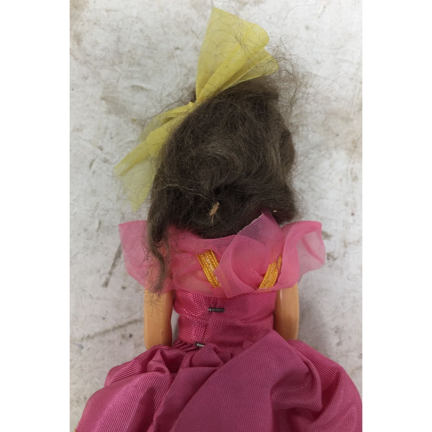 Vintage Collectible Doll Brown Hair, Blue Eyes wearing Pink, Blue, Yellow Dress