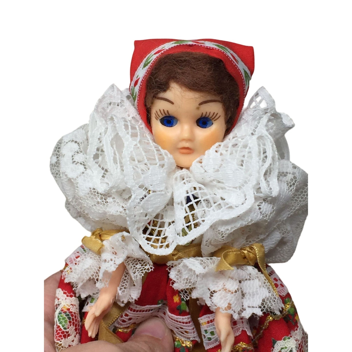 Collectible Brunette/Blue Eyed Doll Wearing Patterned Dress- Head, arms and eyes move.