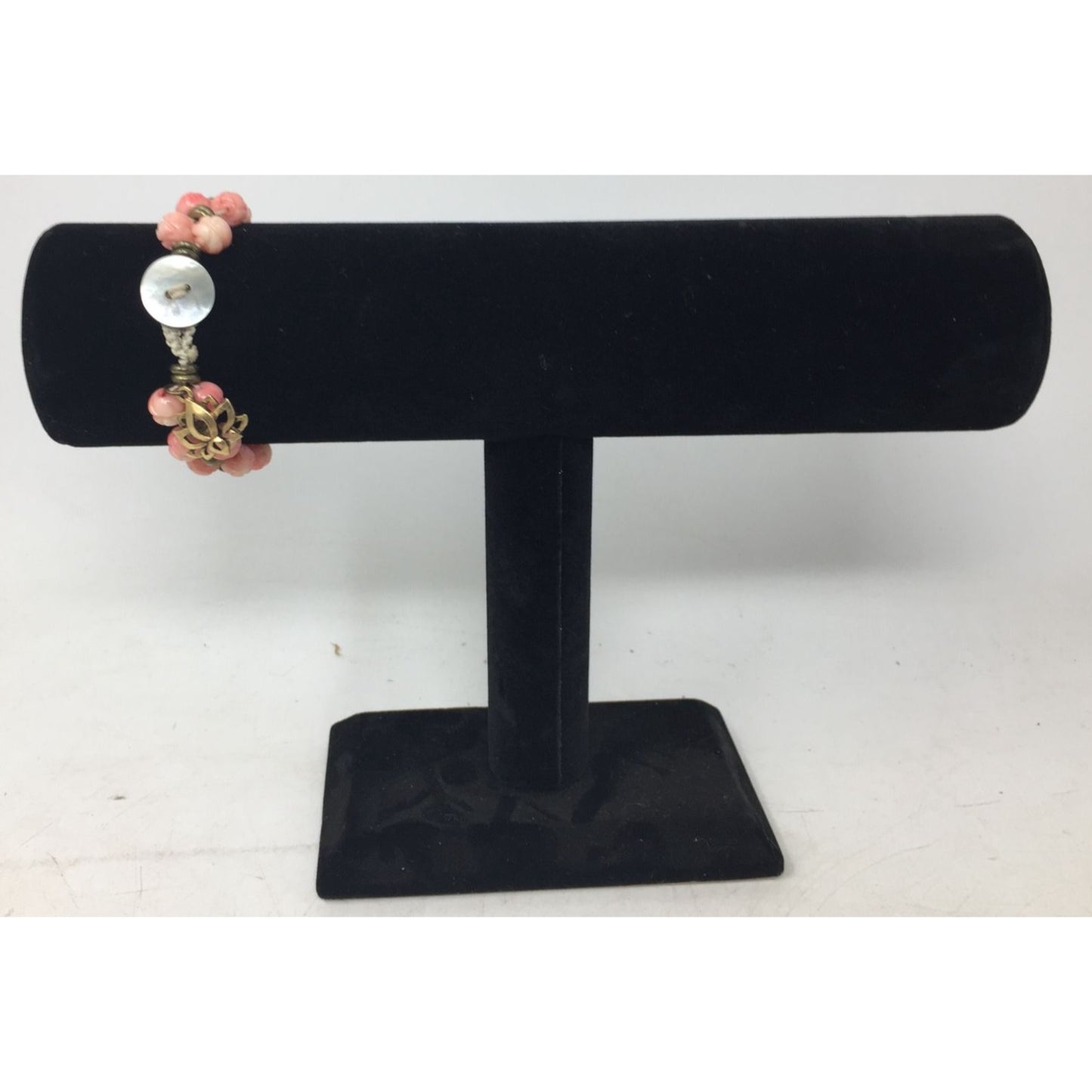 Women's Gold Tone Bracelet with Pink Flowers on it