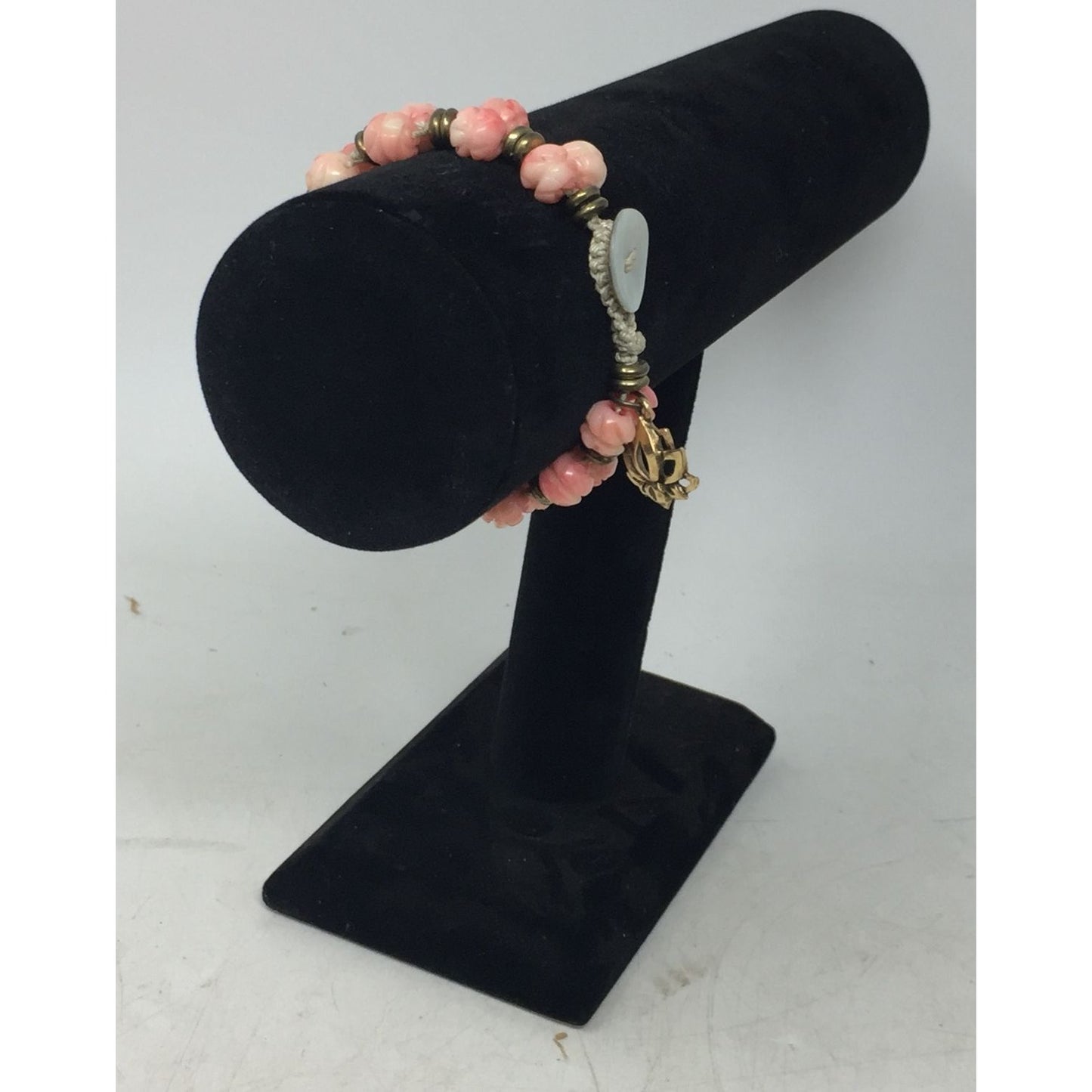 Women's Gold Tone Bracelet with Pink Flowers on it