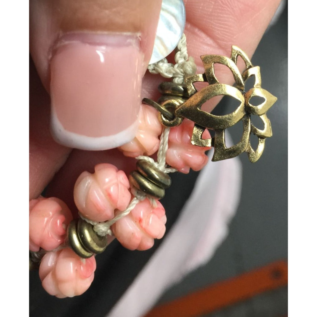 Women's Gold Tone Bracelet with Pink Flowers on it