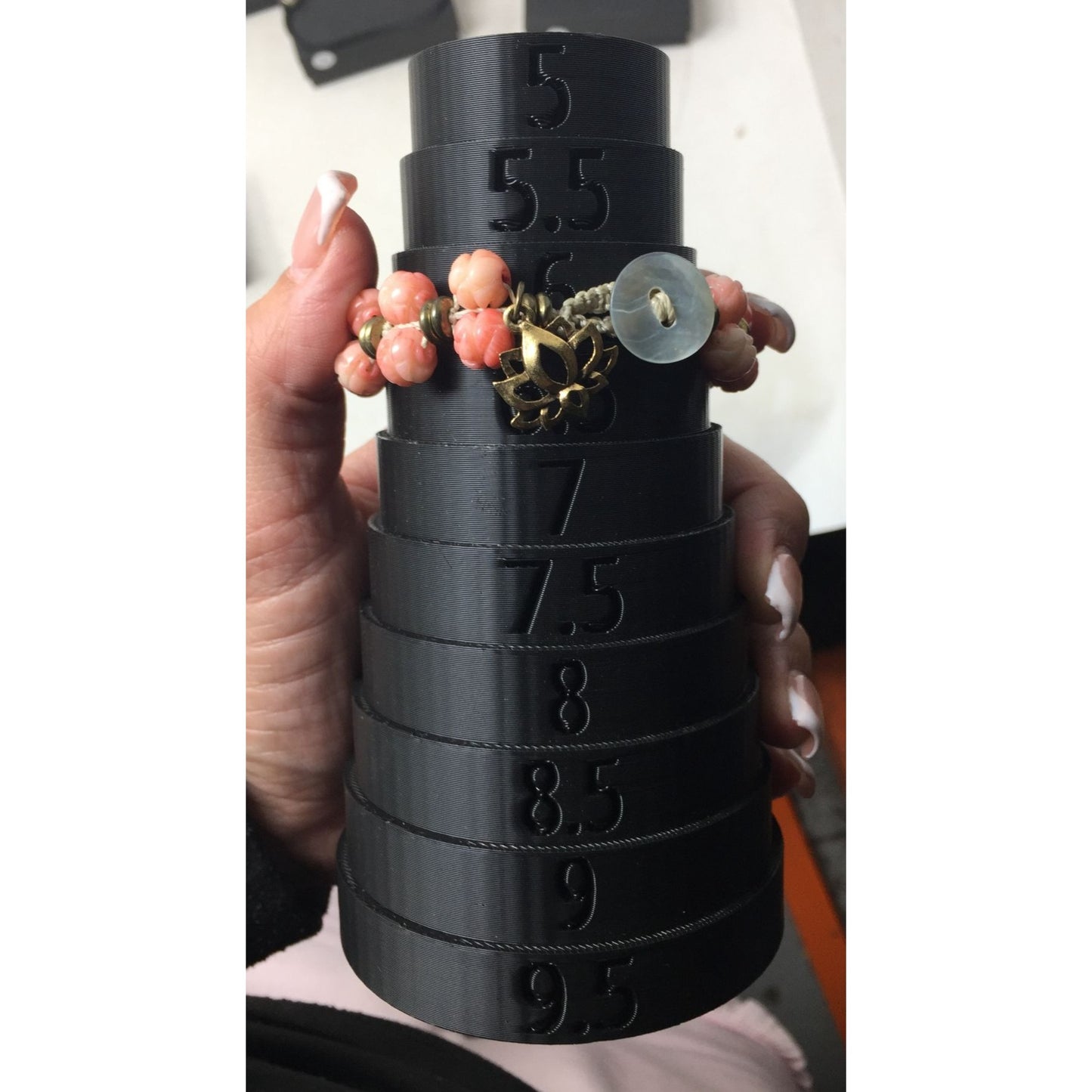 Women's Gold Tone Bracelet with Pink Flowers on it