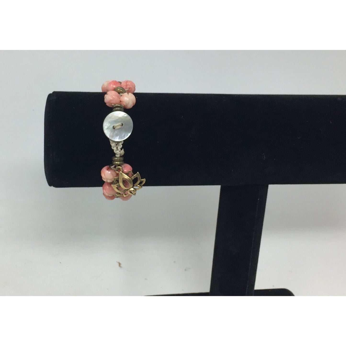 Women's Gold Tone Bracelet with Pink Flowers on it