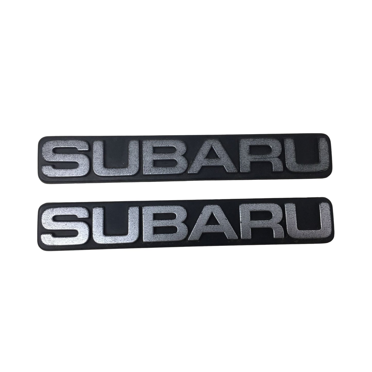 Two Subaru Auto Emblems/Hood Ornaments Silver and Black