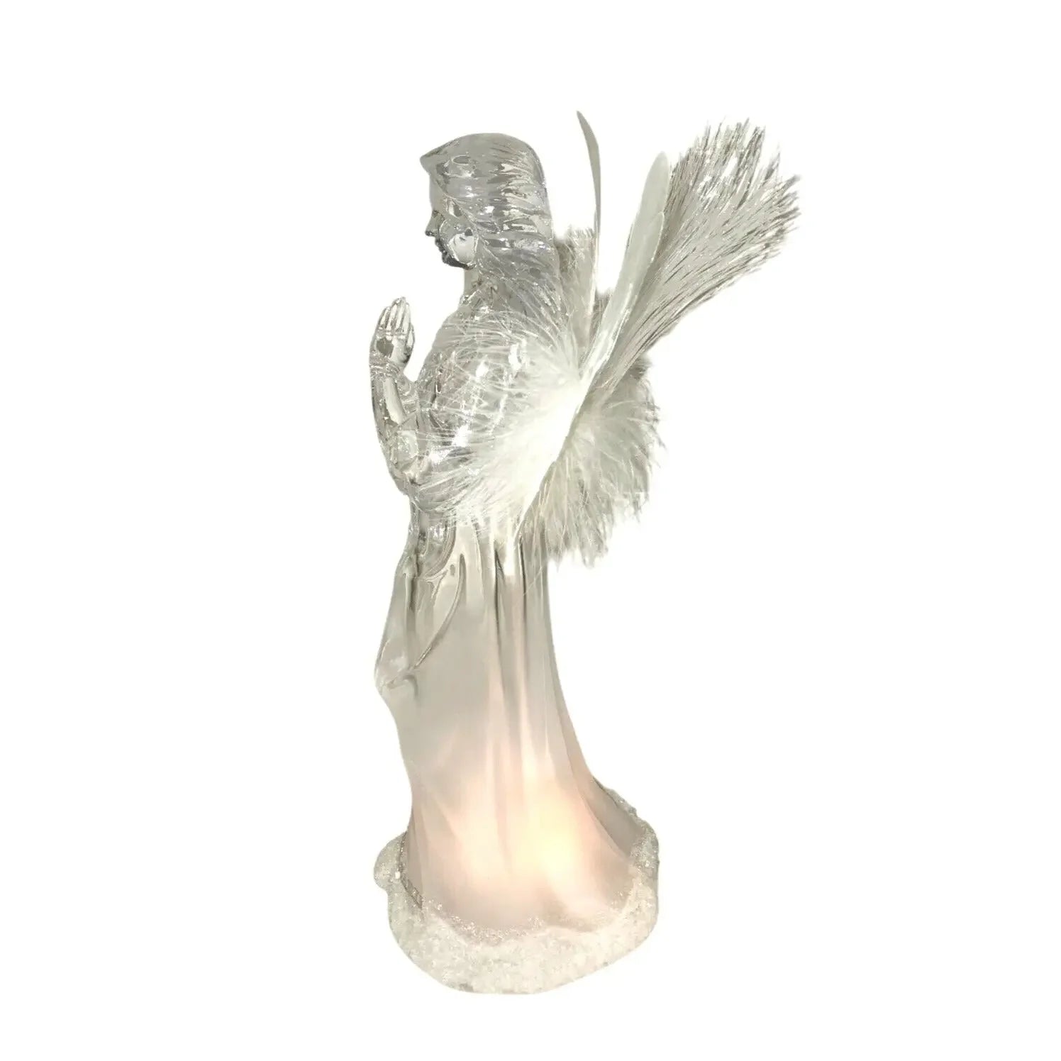 Clear glass angel figurine with feathered wings and illuminated base on white background