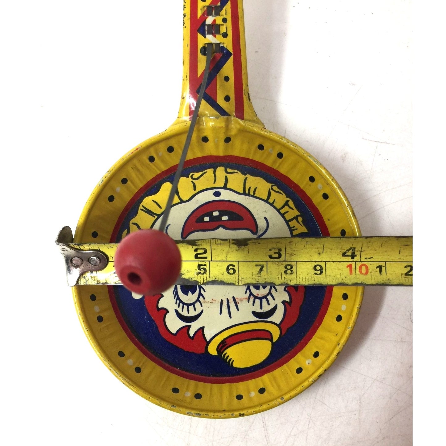 Vintage Kirchhof Clown Yellow Tin Metal Paddle Noise Maker Toy
