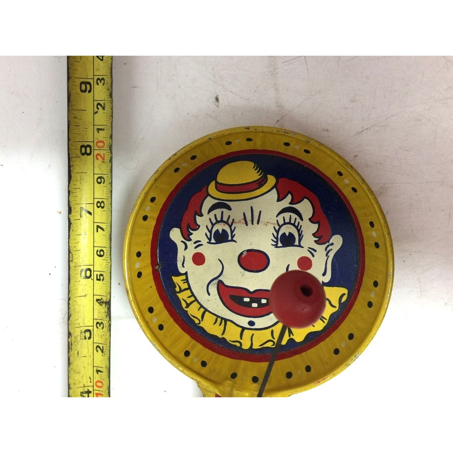 Vintage Kirchhof Clown Yellow Tin Metal Paddle Noise Maker Toy