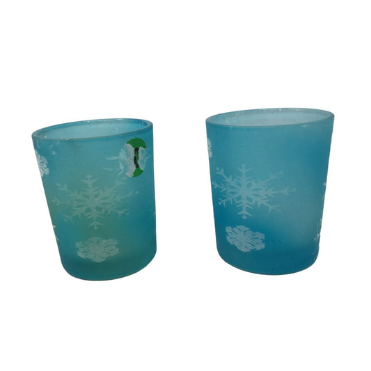 Two Small Blue Tea Light Candle Holders with Snowflake Print on them