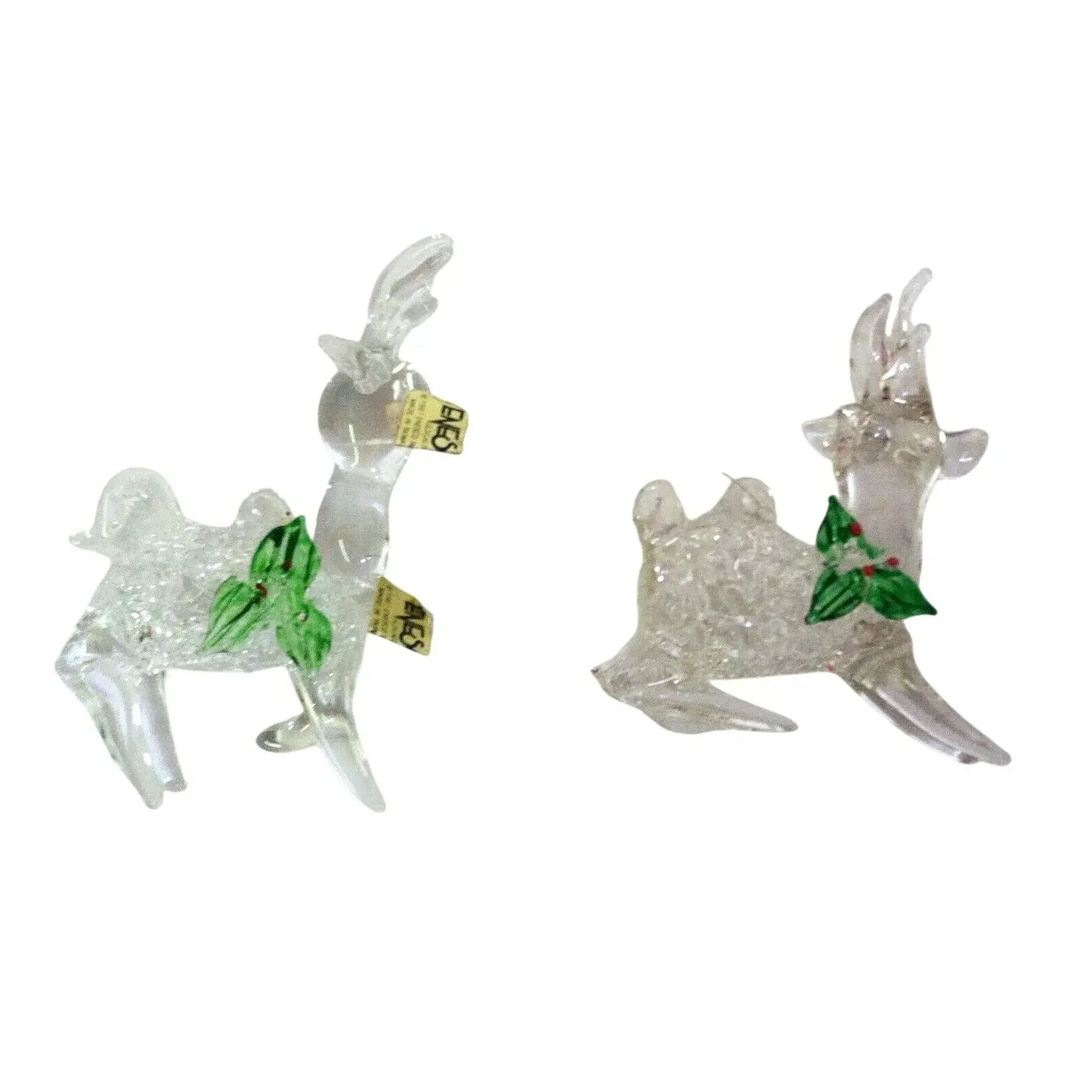 Clear glass reindeer figurines with green holly leaf decorations, holiday decor