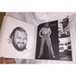 Open vintage photo book showing black and white portraits of a bearded man in retro clothing.