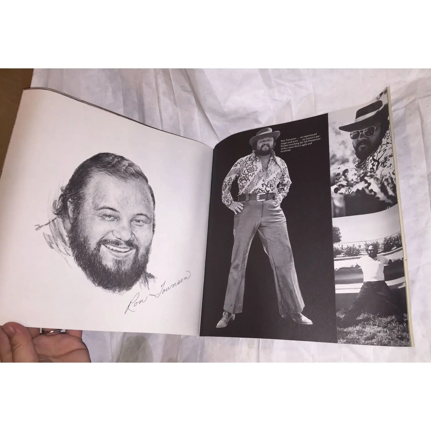 Open vintage photo book showing black and white portraits of a bearded man in retro clothing.