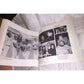 Open book showing black and white photos of baseball players, group portraits, and celebrities.