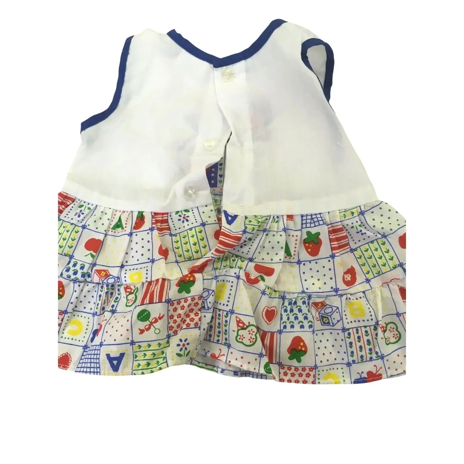 Children's sleeveless dress with white top and colorful patterned skirt featuring fruit and shapes