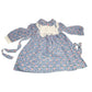 Purple floral long sleeve dress with white lace bib and cuffs, vintage-inspired design