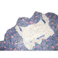 Purple floral dress with lace collar, quilted white bib, and pink rosette accent