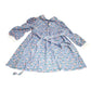 Blue floral long-sleeve dress with white cuffs and tie waist, vintage-inspired design