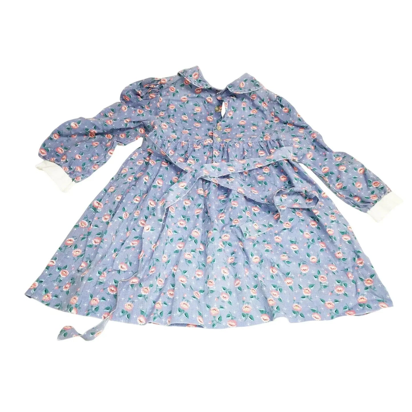 Blue floral long-sleeve dress with white cuffs and tie waist, vintage-inspired design