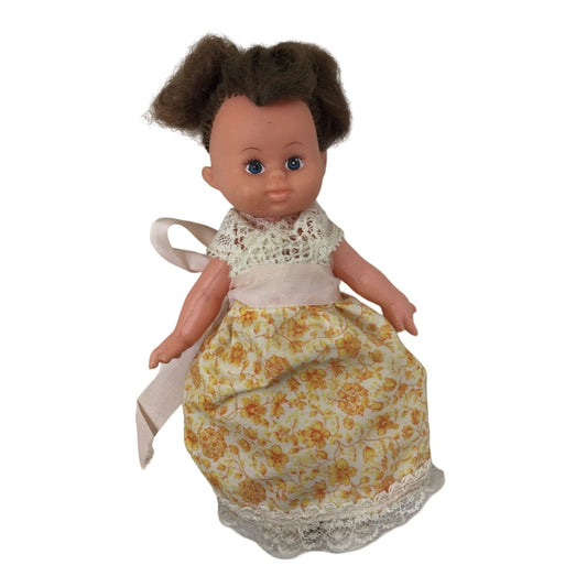 Vintage Collectible Small Baby Doll Brown Hair, Blue Eyes Wearing Yellow Floral Printed Dress