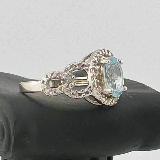 Beautiful Floating Oval Natural Blue Topaz with Textured Detailing and Diamond Accent