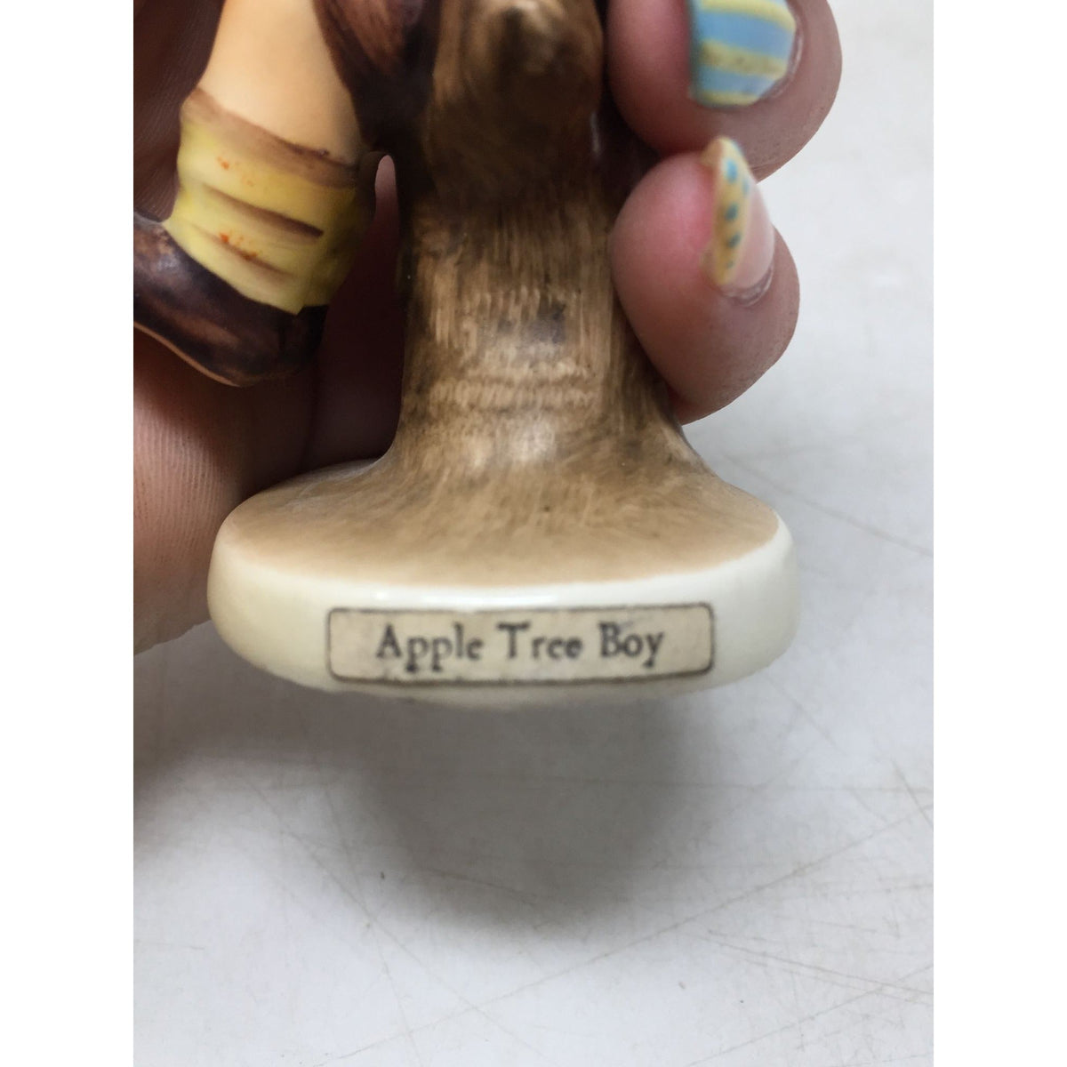 vintage Goebel Hummel "Apple Tree Boy" porcelain figurine (Model #142). A+ Stuff  A+ Stuff Figurines