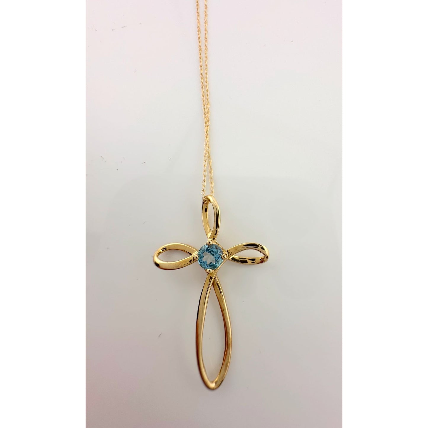 10 Kt Gold Cross Necklace - Beautiful Blue Topaz stone in Center with 10 Kt Gold Chain