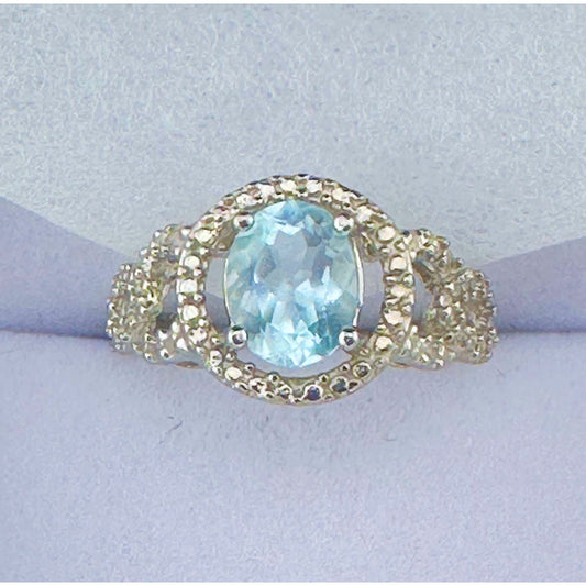 Beautiful Floating Oval Natural Blue Topaz with Textured Detailing and Diamond Accent