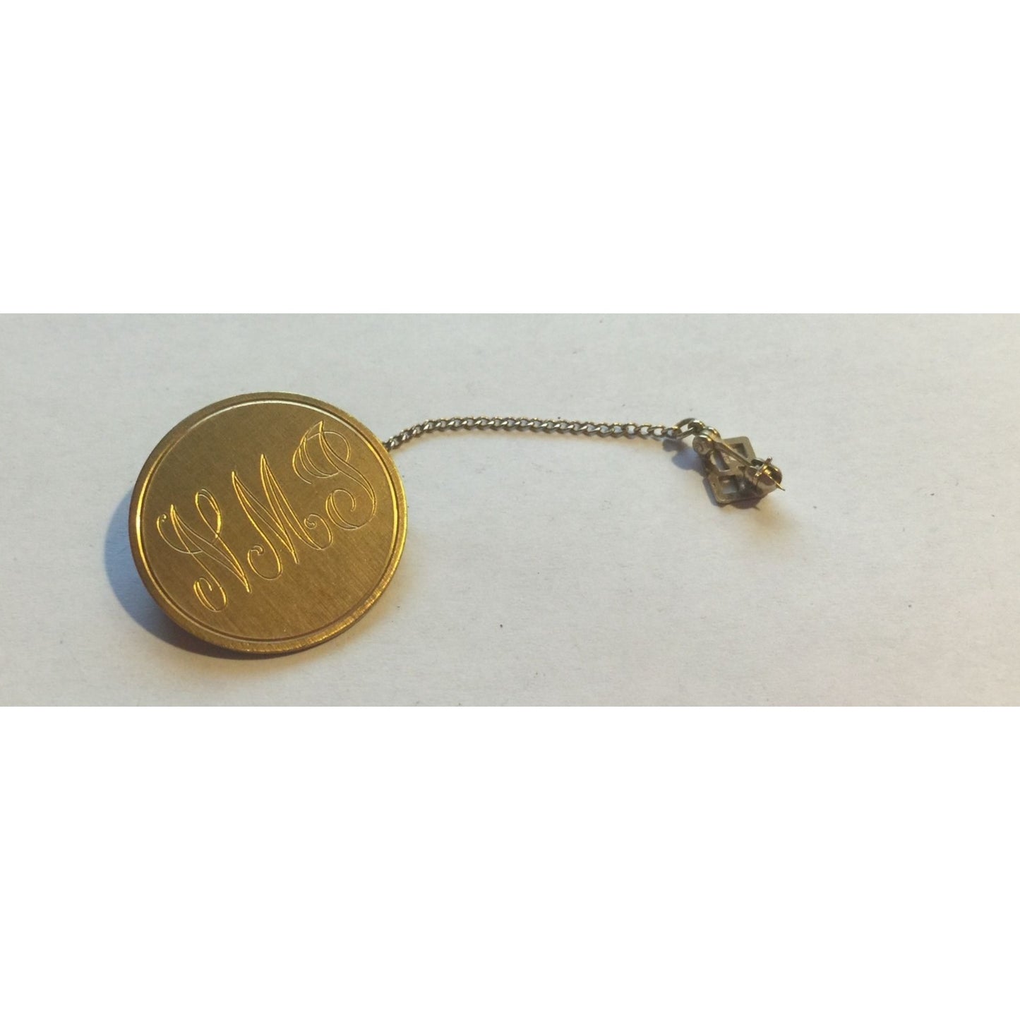 Vintage Gold Toned Pinback Button with Chain with "NMJ" & Numbers 69