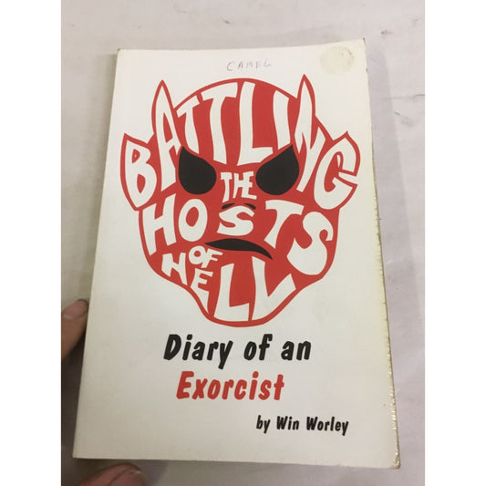 Battling the Hosts of Hell: Diary of an Exorcist Paperback book by Win Worley